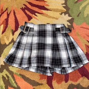Justice black plaid skirt with shorts underneath